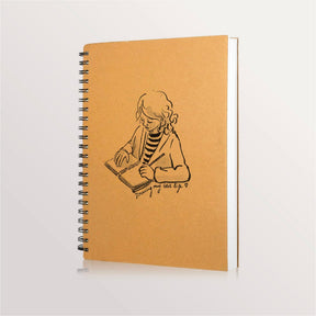 Carnet à dessin à spirale, couverture kraft illustrée d'une fillette qui dessine