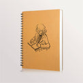 Carnet à dessin à spirale, couverture kraft illustrée d'une fillette qui dessine