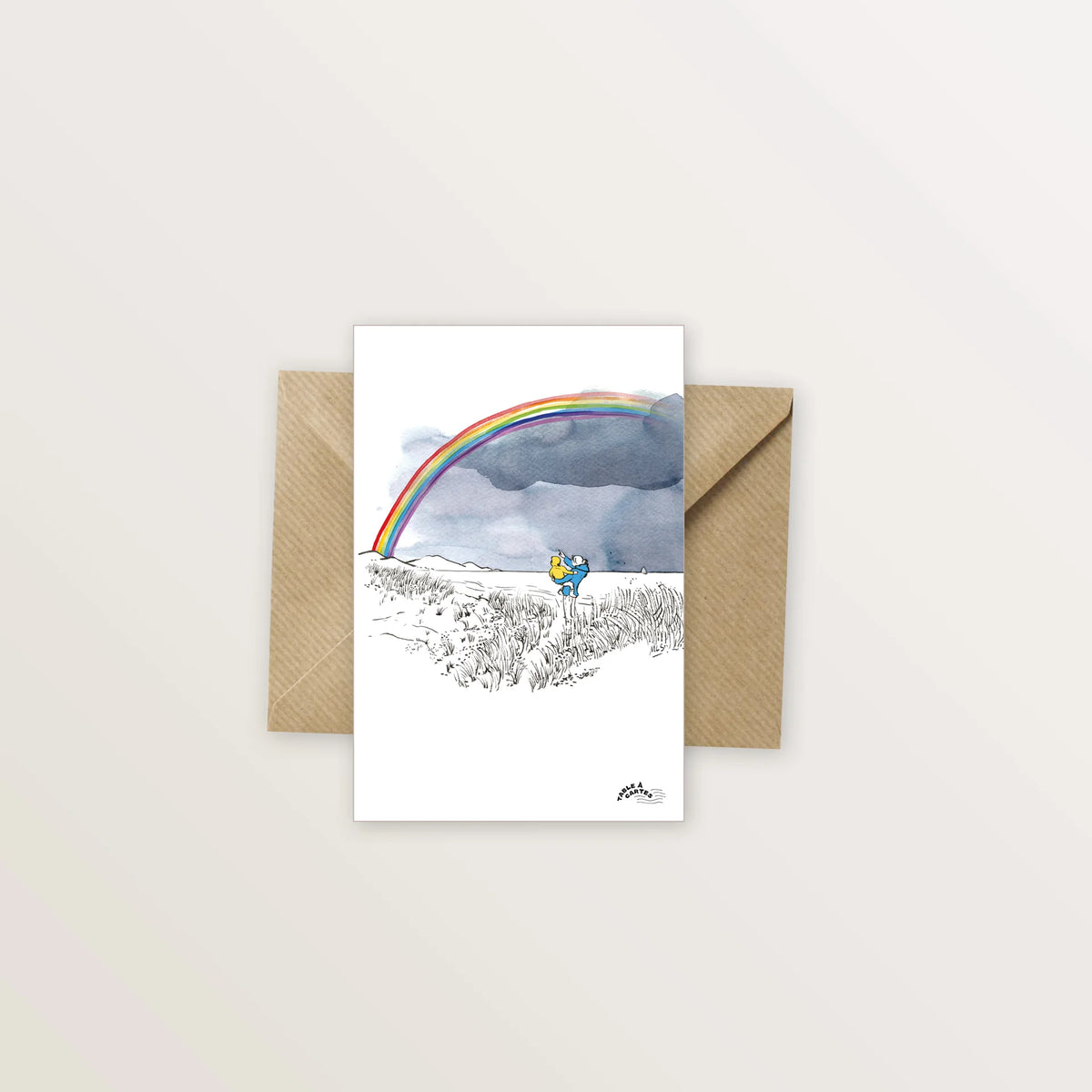 Carte postale « Arc-en-ciel » : arc-en-ciel au-dessus d'un paysage dessiné à l'encre, avec enveloppe kraft