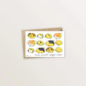 Carte postale Poissons papillons : douze poissons papillons jaunes alignés, avec enveloppe kraft